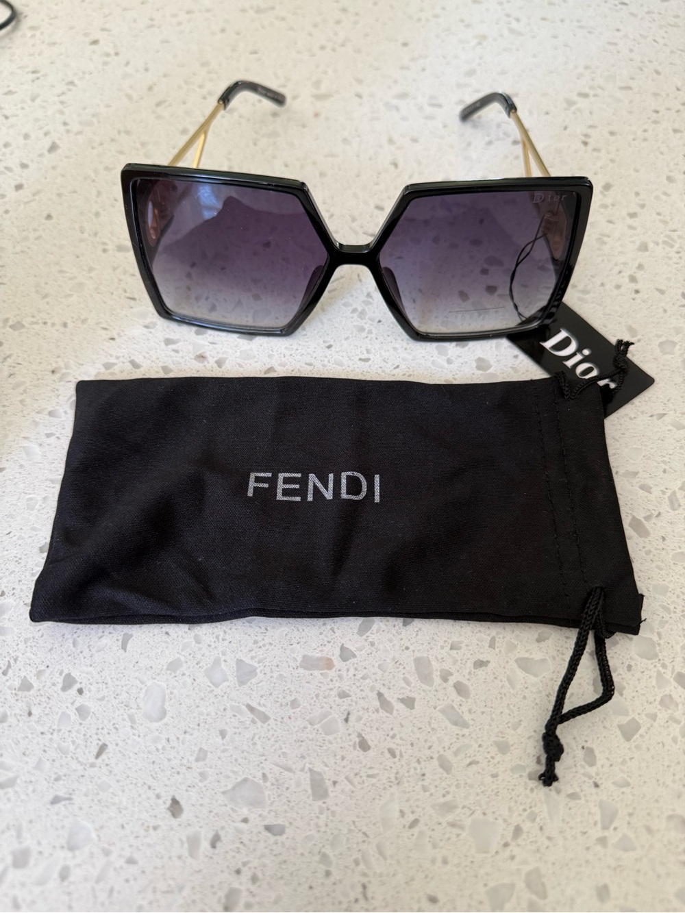 Generic Black Frame Sunglasses with Gold Temples and Purple Gradient Lenses